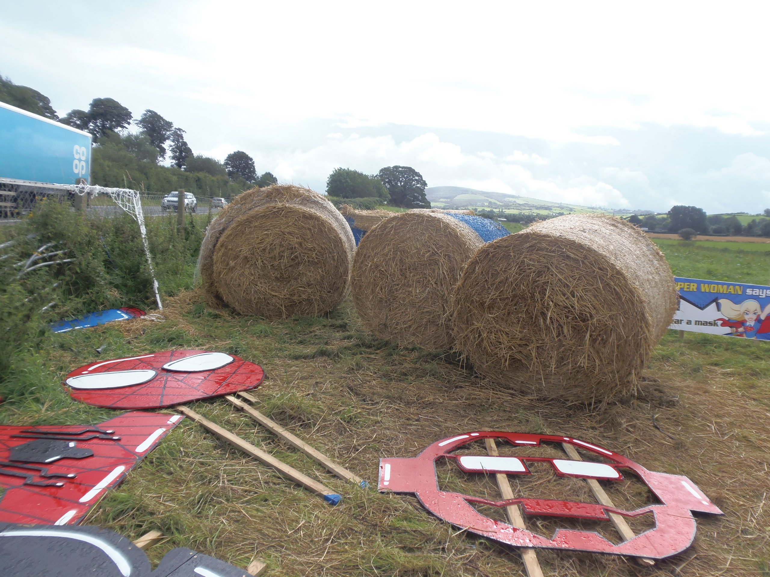 Superhero sculptures battered by wicked wind in Newtown
