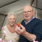 Robert and Gladys Freeborn hold the final strawberry of the day after selling over 200lb weight of the fruit from their stall on Saturday afternoon. JasMc1