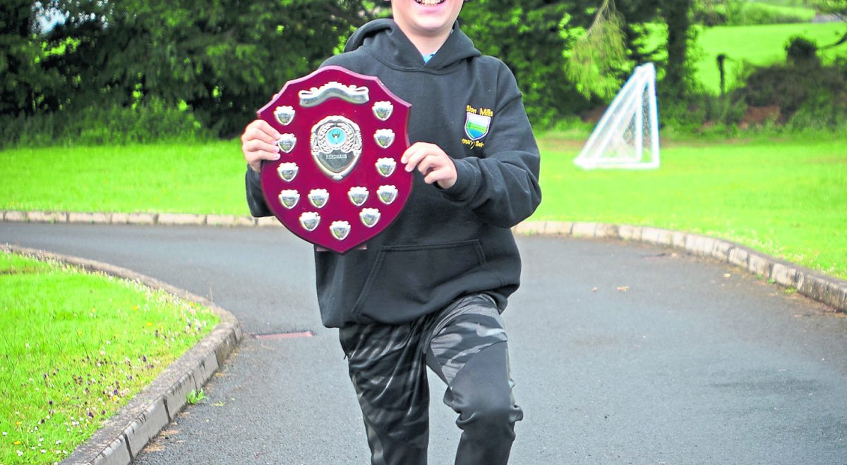 Boys Marathon winner, Harry takes the Herdman's Shield on a speedy lap of the school grounds. JasMc9