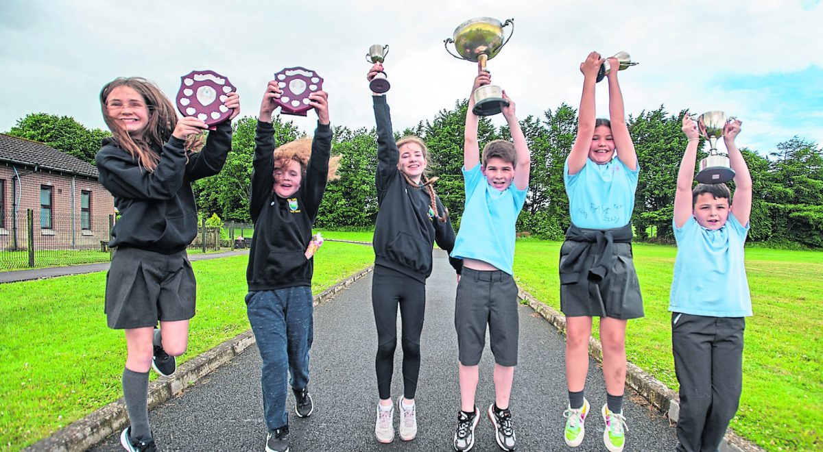 Faye, Bailey, Sive, Conn, Ruby and Robert jump for joy following the end of term prizegiving reception in Sion Mills Controlled Primary School. JasMc12