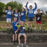 Young runners celebrate after crossing the finish line. JasMc8