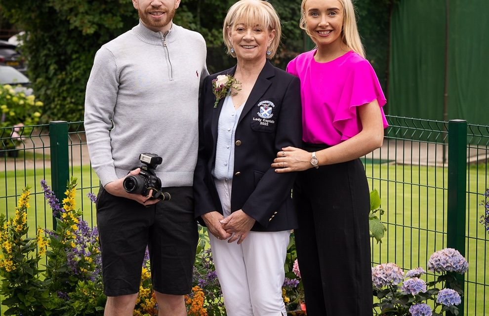Geraldine McCrory pictured with her son Brendan and Hannah alongside some of the beautiful floral displays created by Geraldine's husband Kevin. KMG12