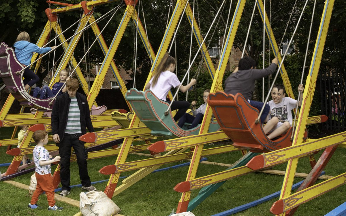 Laughs and smiles on the swinging boats.