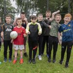 Cage footballers raise a cheer for the Sion Summer Camp.