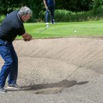 Paul McSwiggan plays his ball from the 18th bunker.JMG12