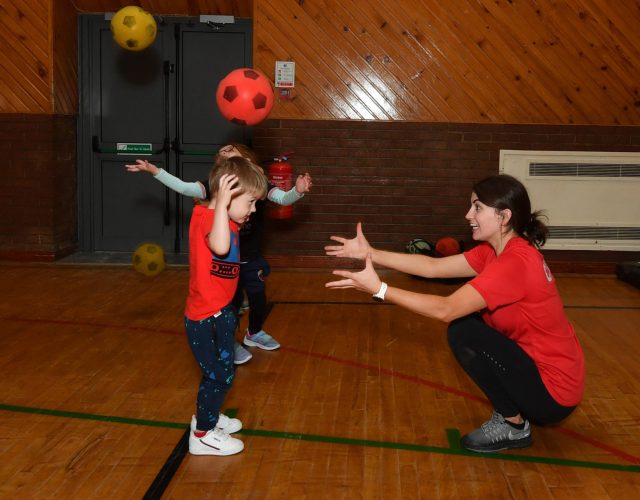 Luca has some fun with one of the Core Fitness instructors who are delivering the fitness and health programme to the children. DR27