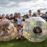 It's girls versus boys in a game of body football. JasMc1