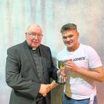 The 'Contribution to School Life' cup was presented to Marcus Kelly, pictured with Fr P MacEntee.
