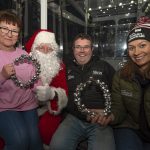 Organisers Mary McLaughlin, Conor Sally and Nicola Canavan join Santa Claus himself on the inaugural spin on the big wheel as St. Enda's Winter Wonderland opens for Christmas 2022. JasMc1