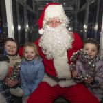 Kai, Bella and Mya Bell experience a spin on the Big Wheel with Santa Claus himself. JasMc2