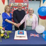 Iris Wallace, Principal of Gortin Primary School, with Adrian Huston, Chair of the School Board of Governors and Jean Crawford, School Board Of Governors, and baker the Special Cake to mark His Majesty King Charles III Coronation.JMG11